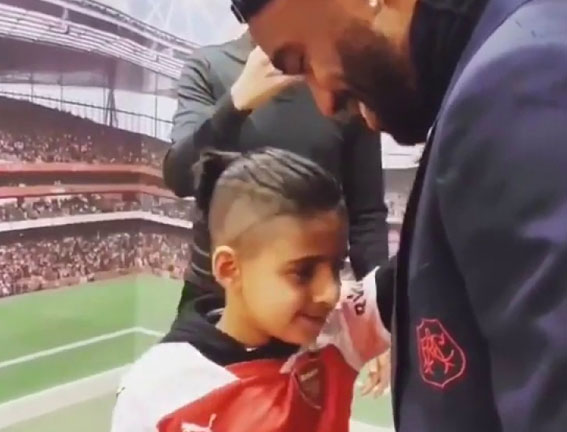 Watch amazing moment blind boy, 9, feels Lacazette’s face as he meets his Arsenal hero